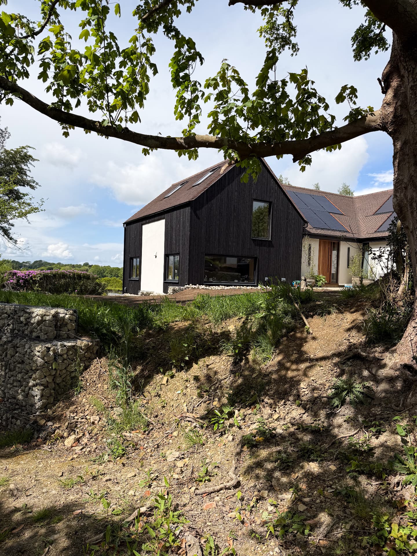 House clad in larch with a KIME Black finish